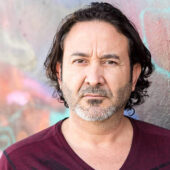 Mature hispanic man looking at the camera